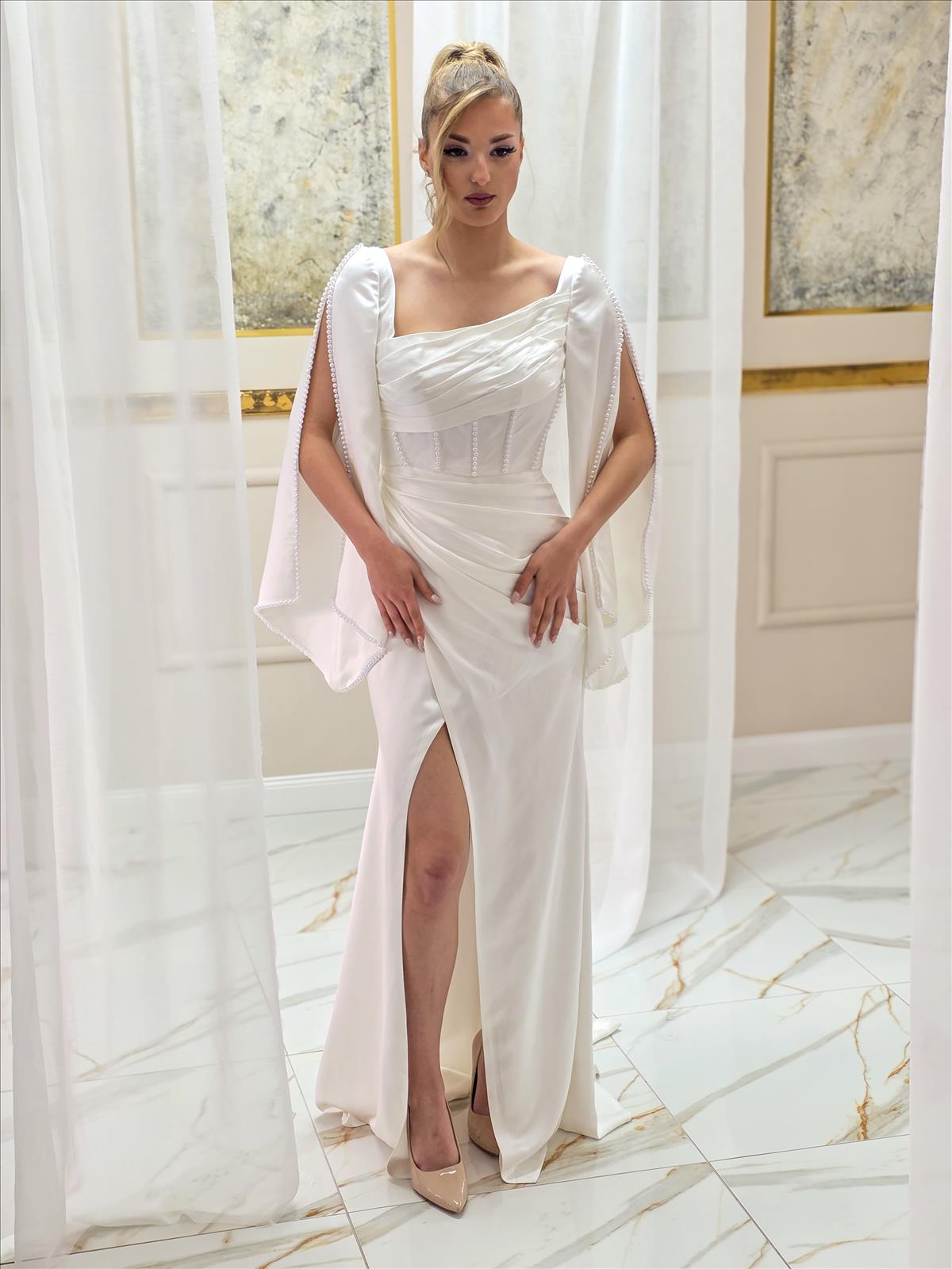 Hier geht's zum Shop von: Tasquira - Abendmode, Brautmode | Kategorie: Brautkleider | Adresse: Tasquira - Friedrich-Lange-Str. 28 - 45356 Essen - Tel: 017670016489 - neschekurtova@yahoo.de | Angebot: Damenbekleidung, Damen Accessoires, Schuhe, Young Fashion, Sofortprogramme, Orderware
